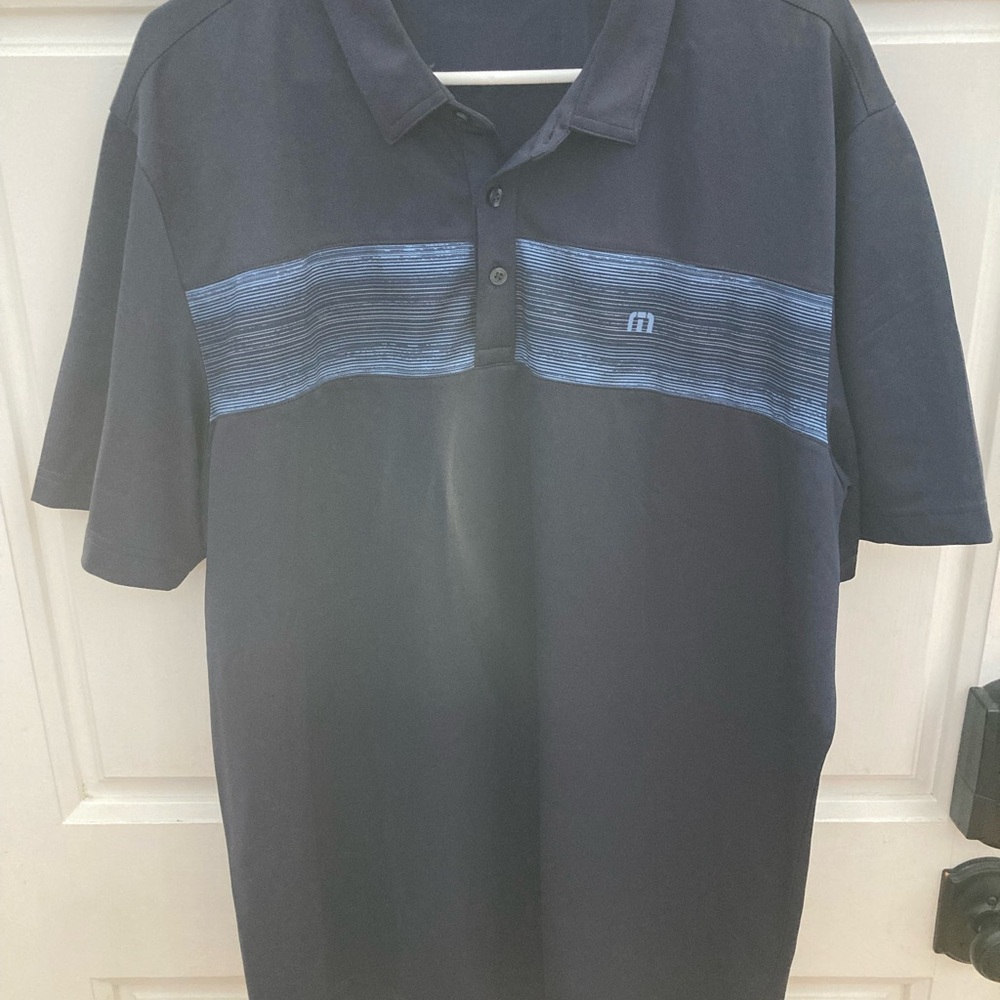 Travis Mathew Navy Polo with Light Blue Stripes